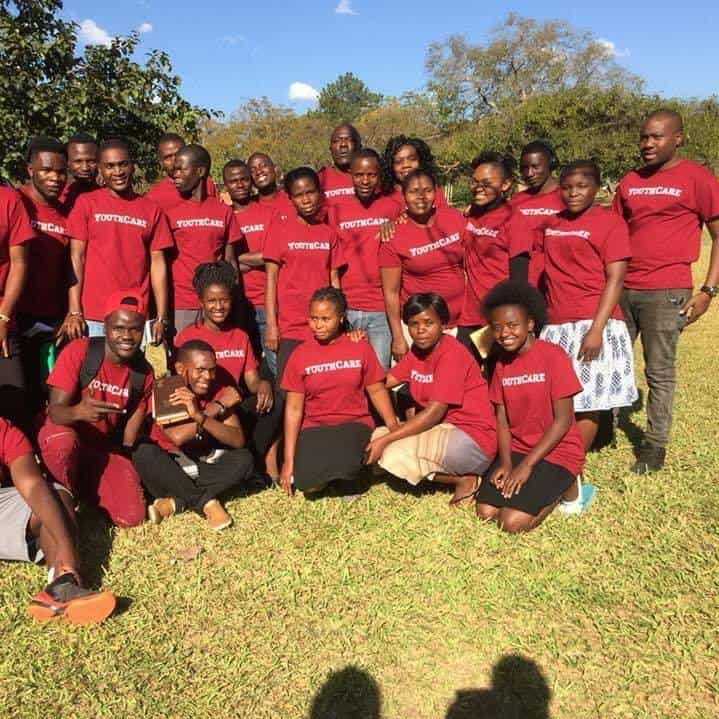 Camp group in red shirts